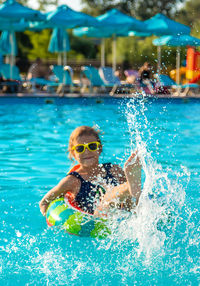 Man swimming in pool