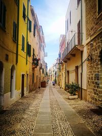 Narrow alley amidst buildings in town