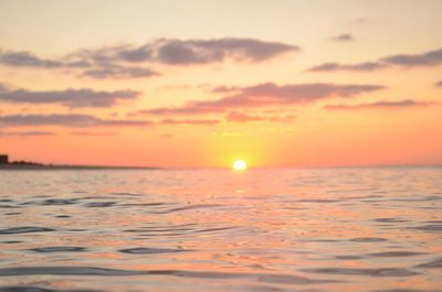 Scenic view of sea at sunset