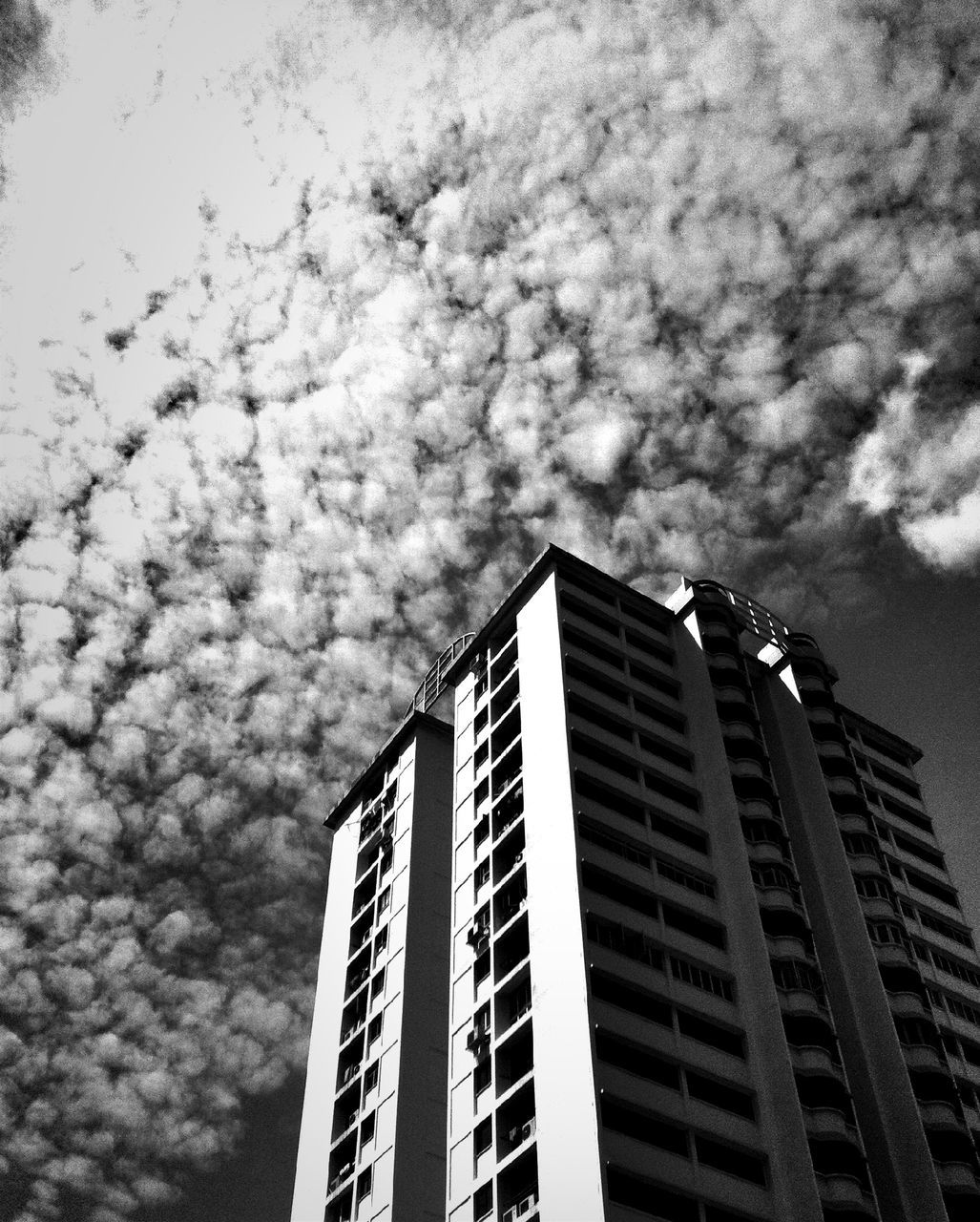 architecture, building exterior, low angle view, built structure, sky, city, cloud - sky, modern, cloudy, office building, skyscraper, building, tall - high, cloud, tower, overcast, outdoors, no people, weather, day