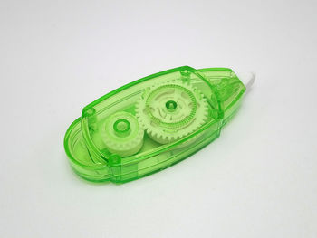 High angle view of green toy against white background