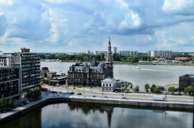 Bridge over river with buildings in background