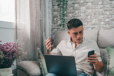Young man using mobile phone