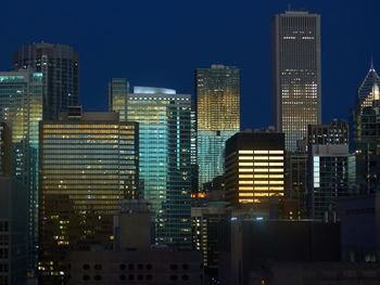 Modern buildings in city at night