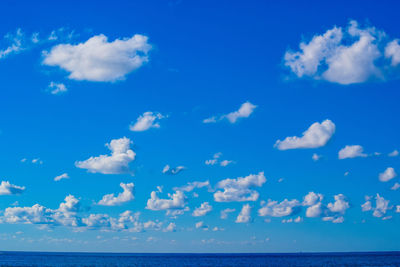 Scenic view of sea against blue sky