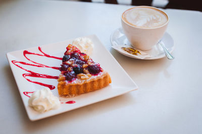 Close-up of coffee cup on table