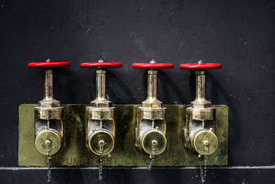 Machine valves against wall