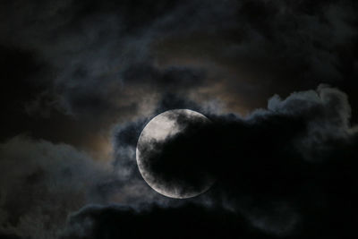 Low angle view of moon against sky at night