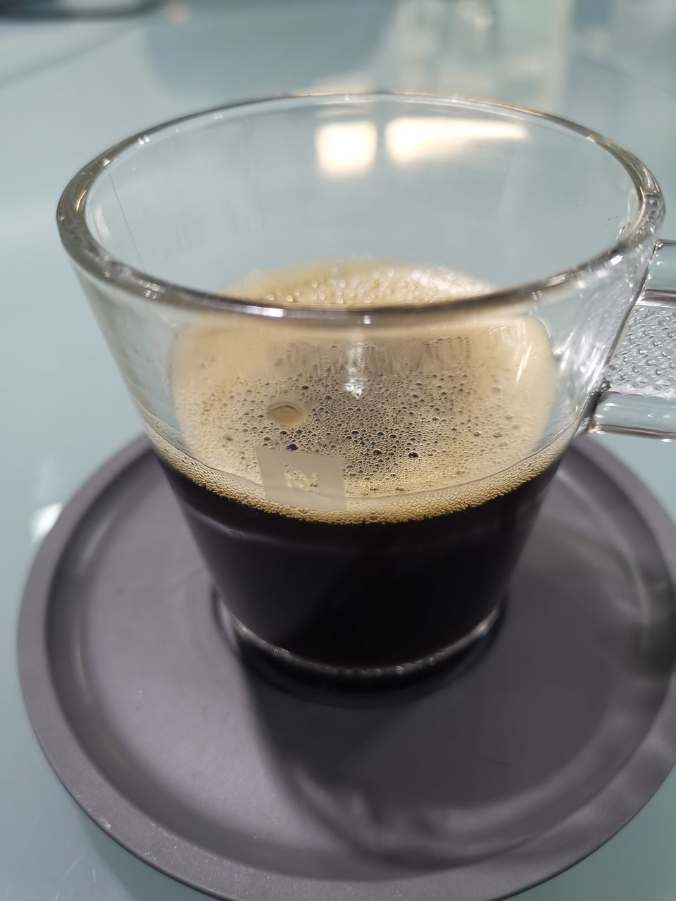 CLOSE-UP OF COFFEE ON TABLE