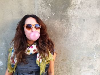 Portrait of girl wearing sunglasses standing outdoors