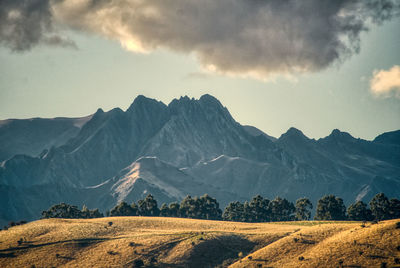 Scenic view of mountains against sky during sunset