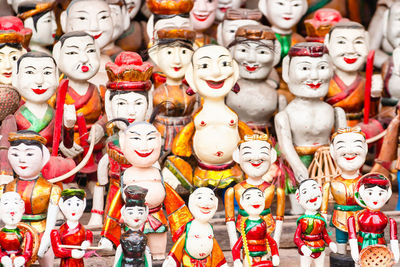 Full frame shot of dolls for sale at market stall