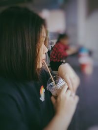 Close-up portrait of woman holding ice cream