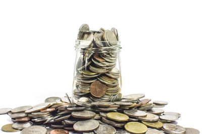 Close-up of coins on white background