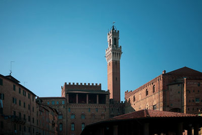 Tower of mangia, pubblico palace, piazza del campo, siena, italy