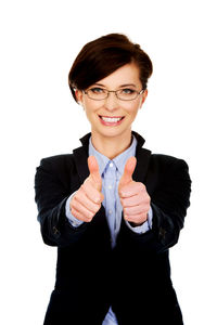 Portrait of smiling young woman against white background