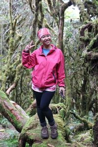 Portrait of smiling woman in forest