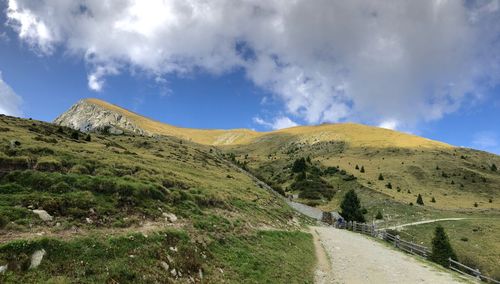 Panoramic view of road amidst mountains against sky