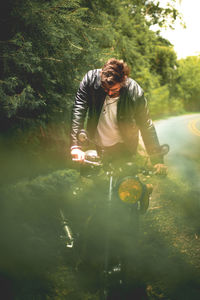 Full length of young man against trees