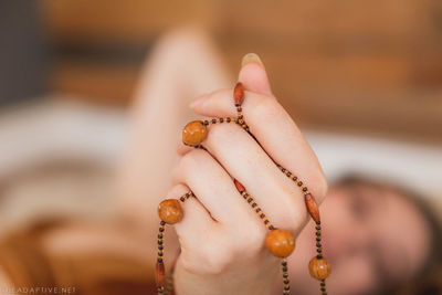 Close-up of woman hand holding ring