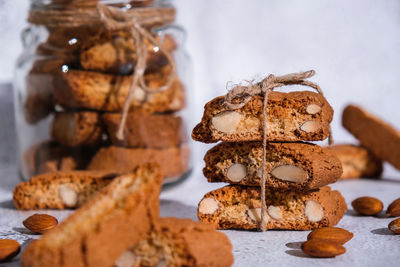 Traditional italian cantuccini cookies with almonds in glass jar. sweet dried biscuits. homemade