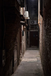 Narrow alley amidst buildings in city