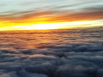 Scenic view of dramatic sky at sunset