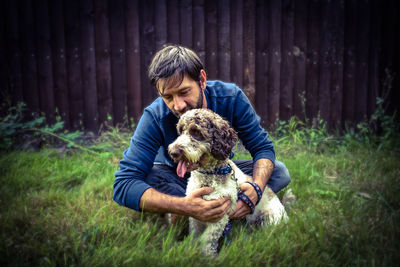 Full length of a man with dog