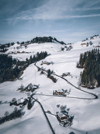 Scenic view of snow covered landscape against sky