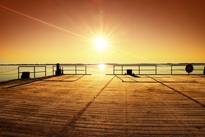 Empty wooden pier at beautiful colorful morning. tourist wharf in bay of sea.