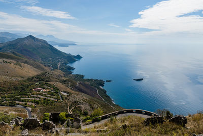 Scenic view of sea against cloudy sky