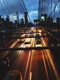 Traffic on suspension bridge in city