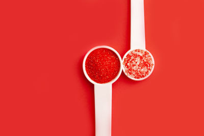 Close-up of strawberry against red background