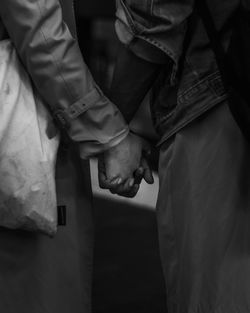 Close up of couple holding hands 