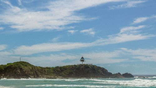 Scenic view of sea against blue sky