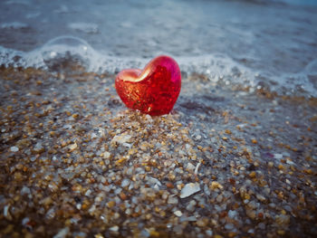 Close-up of heart shape on sand