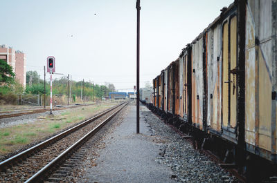 Train on railroad tracks against clear sky