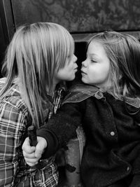 Portrait of mother with daughter in hands