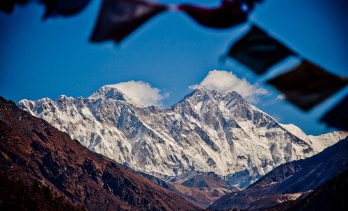 Close-up of mountains against blue sky