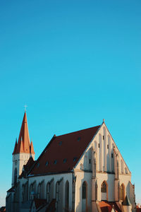 Low angle view of building against clear blue sky