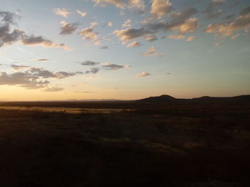 Scenic view of silhouette landscape against sky during sunset