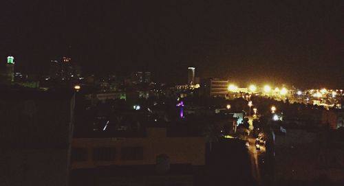 High angle view of illuminated buildings in city at night