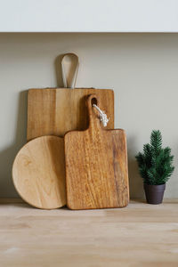 Minimalistic christmas kitchen decor wooden cutting boards of various shapes and a small christmas 