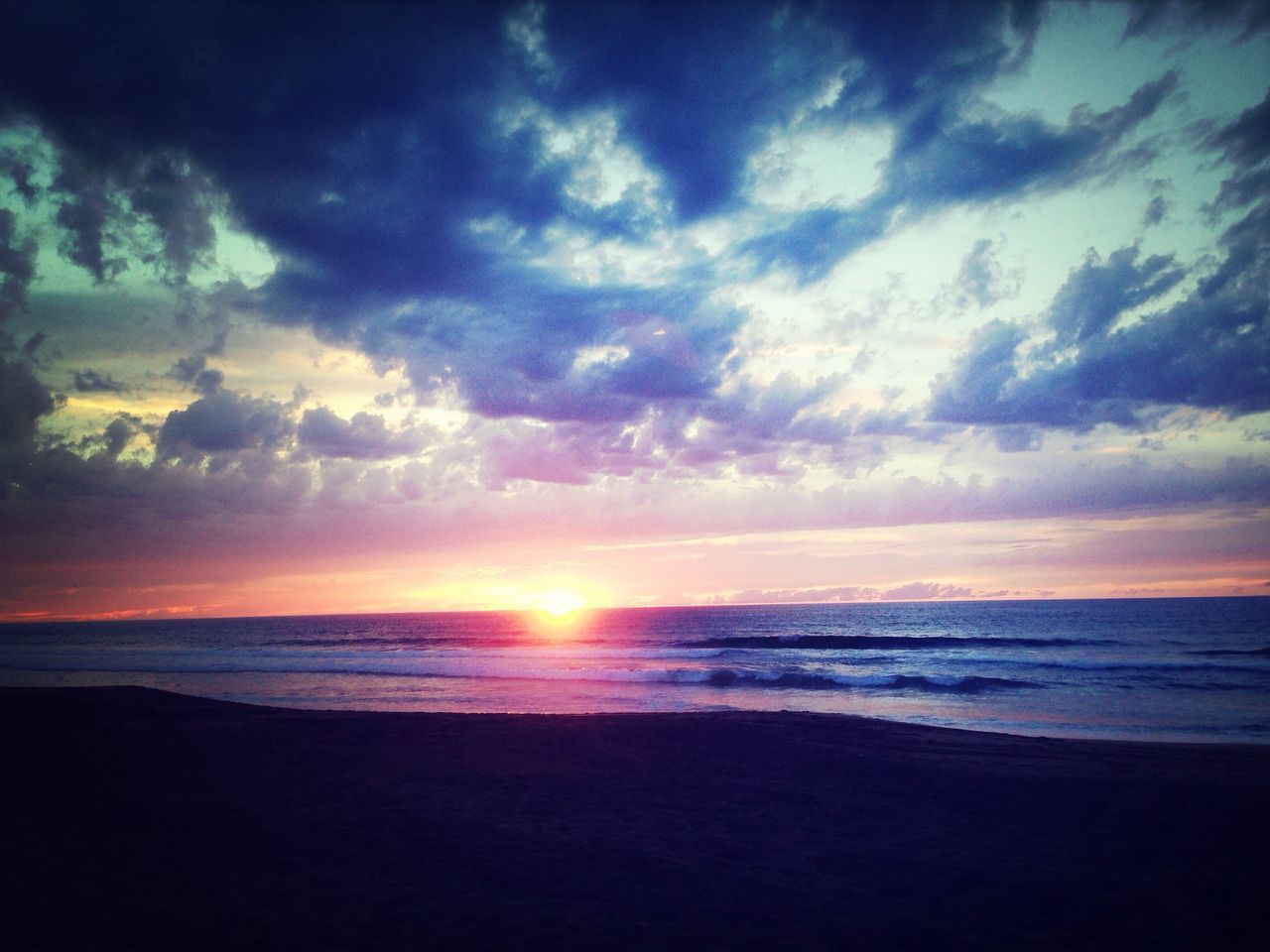 sea, sunset, horizon over water, beach, scenics, sky, water, tranquil scene, beauty in nature, tranquility, shore, sun, cloud - sky, idyllic, orange color, nature, cloud, silhouette, sand, cloudy