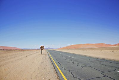 Long road in desert landscape