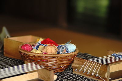 Close-up of fruits in basket on table