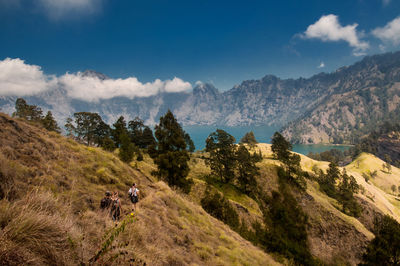 People walking to segara anak lake rinjani mountain