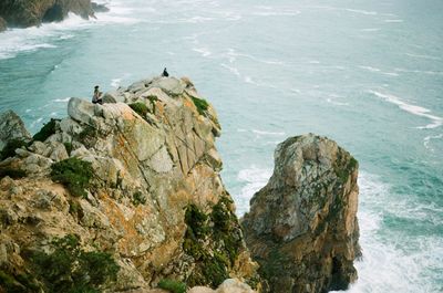 High angle view of rock formation by sea