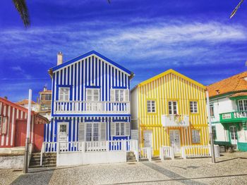 Buildings against blue sky and clouds