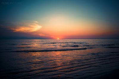 Scenic view of sea against sky at sunset